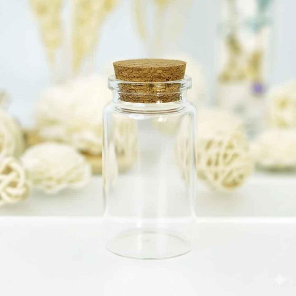 Clear glass jar with cork lid on white background, decorative display, empty container