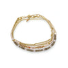Multi-layer gold chain bracelet with pink and beige beads, delicate jewelry accessory