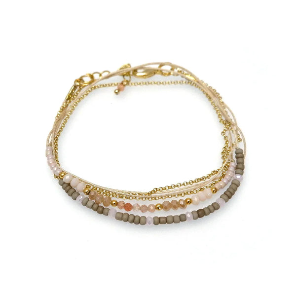 Multi-layer gold chain bracelet with pink and beige beads, delicate jewelry accessory